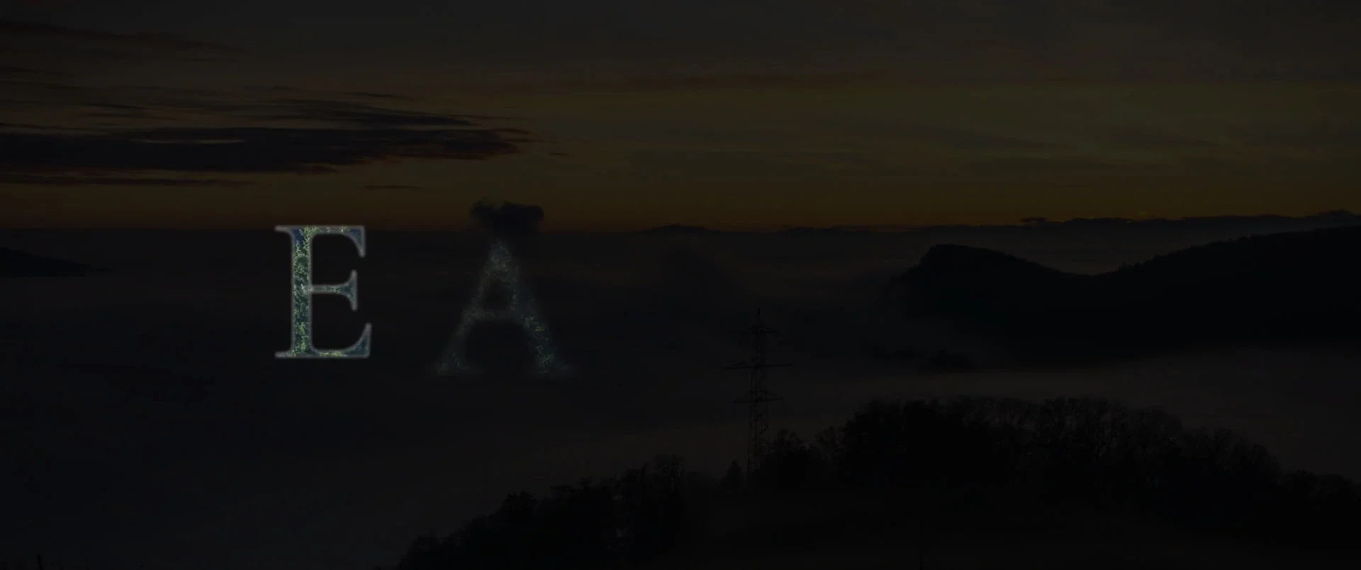 The first letters of EARTH rising out of black