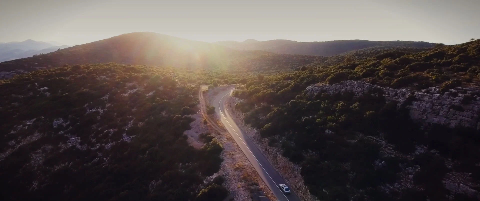 Mountain road at sunset